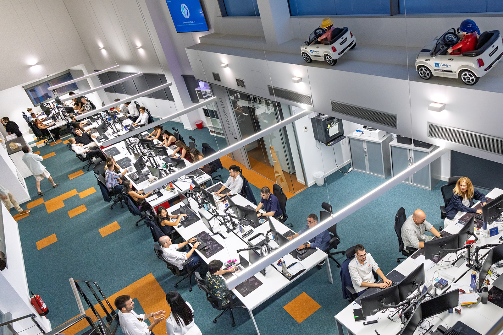 Open space office at ByteTravel with employees working – company branding photography of modern workplace